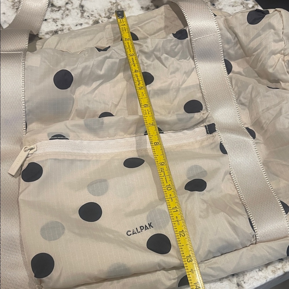 Calpak Cream Travel Duffel with Black Polka Dots - Picture 5 of 5